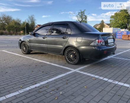 Сірий Міцубісі Lancer, об'ємом двигуна 1.58 л та пробігом 232 тис. км за 2899 $, фото 14 на Automoto.ua