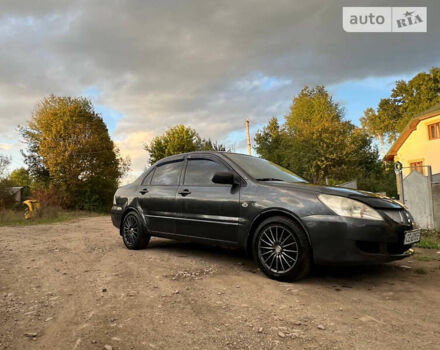 Сірий Міцубісі Lancer, об'ємом двигуна 1.58 л та пробігом 232 тис. км за 2899 $, фото 23 на Automoto.ua