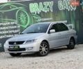 Серый Мицубиси Лансер, объемом двигателя 1.58 л и пробегом 330 тыс. км за 5000 $, фото 1 на Automoto.ua