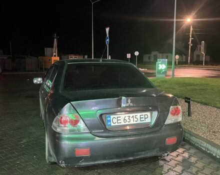 Серый Мицубиси Лансер, объемом двигателя 1.6 л и пробегом 269 тыс. км за 2999 $, фото 4 на Automoto.ua