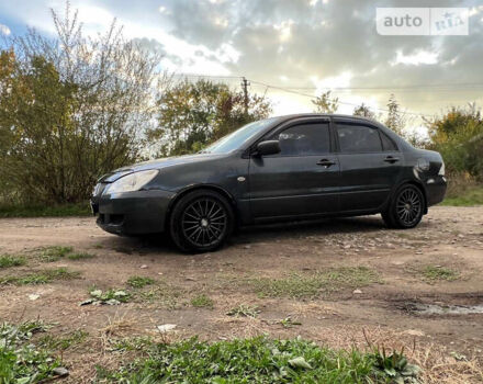 Сірий Міцубісі Lancer, об'ємом двигуна 1.58 л та пробігом 232 тис. км за 2899 $, фото 20 на Automoto.ua