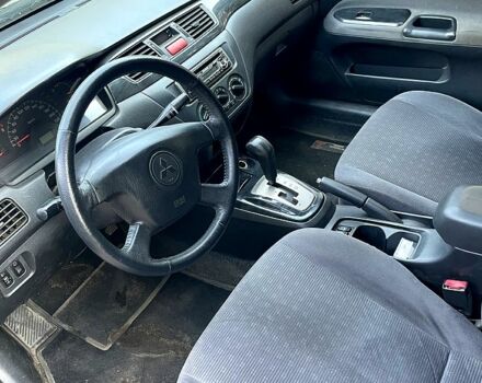 Серый Мицубиси Лансер, объемом двигателя 1.6 л и пробегом 281 тыс. км за 4700 $, фото 5 на Automoto.ua