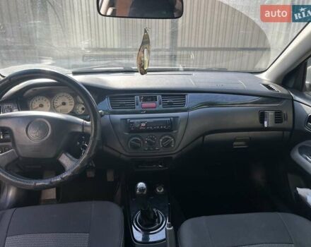 Сірий Міцубісі Lancer, об'ємом двигуна 1.58 л та пробігом 262 тис. км за 3900 $, фото 5 на Automoto.ua