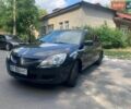 Серый Мицубиси Лансер, объемом двигателя 1.59 л и пробегом 300 тыс. км за 2499 $, фото 1 на Automoto.ua