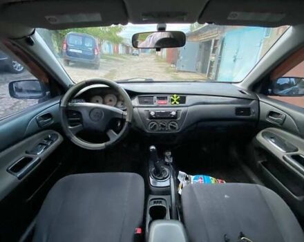 Сірий Міцубісі Lancer, об'ємом двигуна 1.58 л та пробігом 307 тис. км за 3800 $, фото 7 на Automoto.ua