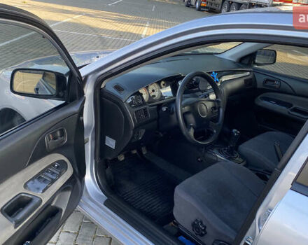 Сірий Міцубісі Lancer, об'ємом двигуна 1.58 л та пробігом 270 тис. км за 1999 $, фото 11 на Automoto.ua