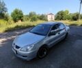 Серый Мицубиси Лансер, объемом двигателя 1.6 л и пробегом 360 тыс. км за 3000 $, фото 1 на Automoto.ua
