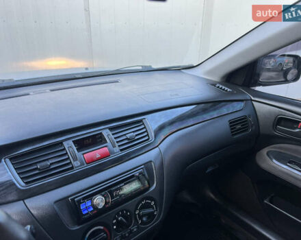 Серый Мицубиси Лансер, объемом двигателя 1.6 л и пробегом 320 тыс. км за 3650 $, фото 34 на Automoto.ua