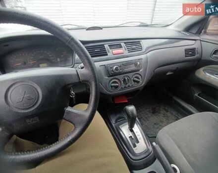 Серый Мицубиси Лансер, объемом двигателя 1.58 л и пробегом 300 тыс. км за 2550 $, фото 3 на Automoto.ua