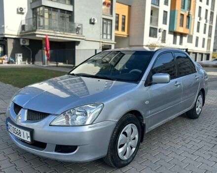 Сірий Міцубісі Lancer, об'ємом двигуна 1.59 л та пробігом 200 тис. км за 1899 $, фото 1 на Automoto.ua