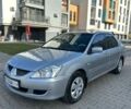 Сірий Міцубісі Lancer, об'ємом двигуна 1.59 л та пробігом 200 тис. км за 1899 $, фото 1 на Automoto.ua