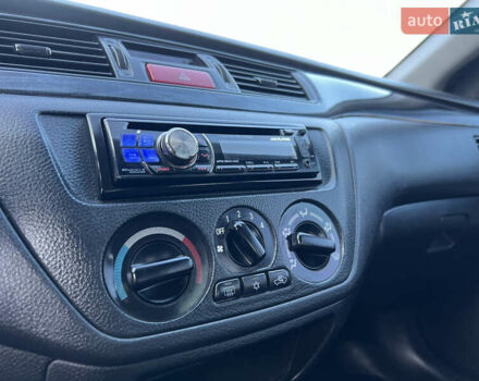 Серый Мицубиси Лансер, объемом двигателя 1.6 л и пробегом 320 тыс. км за 3650 $, фото 33 на Automoto.ua