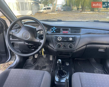 Сірий Міцубісі Lancer, об'ємом двигуна 1.58 л та пробігом 271 тис. км за 3000 $, фото 24 на Automoto.ua