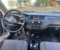 Сірий Міцубісі Lancer, об'ємом двигуна 1.58 л та пробігом 271 тис. км за 3000 $, фото 24 на Automoto.ua