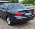 Сірий Міцубісі Lancer, об'ємом двигуна 1.6 л та пробігом 211 тис. км за 3800 $, фото 6 на Automoto.ua