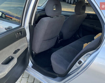 Сірий Міцубісі Lancer, об'ємом двигуна 1.58 л та пробігом 270 тис. км за 1999 $, фото 15 на Automoto.ua