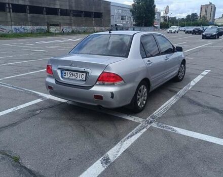 Сірий Міцубісі Lancer, об'ємом двигуна 1.6 л та пробігом 242 тис. км за 4300 $, фото 4 на Automoto.ua