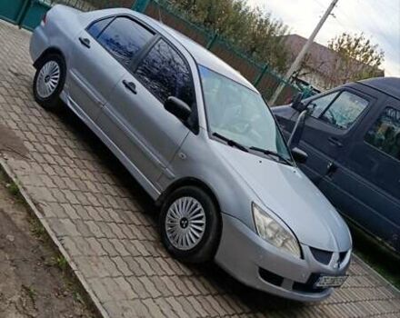 Сірий Міцубісі Lancer, об'ємом двигуна 1.58 л та пробігом 439 тис. км за 2500 $, фото 7 на Automoto.ua