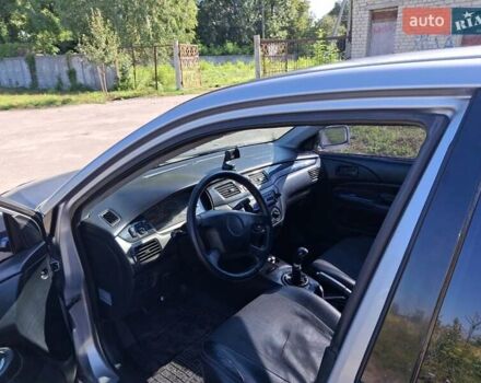 Серый Мицубиси Лансер, объемом двигателя 1.58 л и пробегом 270 тыс. км за 3800 $, фото 3 на Automoto.ua