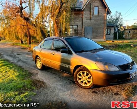 Серый Мицубиси Лансер, объемом двигателя 1.6 л и пробегом 275 тыс. км за 3000 $, фото 2 на Automoto.ua