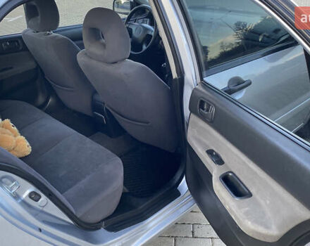 Сірий Міцубісі Lancer, об'ємом двигуна 1.58 л та пробігом 270 тис. км за 1999 $, фото 14 на Automoto.ua