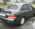 Сірий Міцубісі Lancer, об'ємом двигуна 1.58 л та пробігом 110 тис. км за 2999 $, фото 7 на Automoto.ua