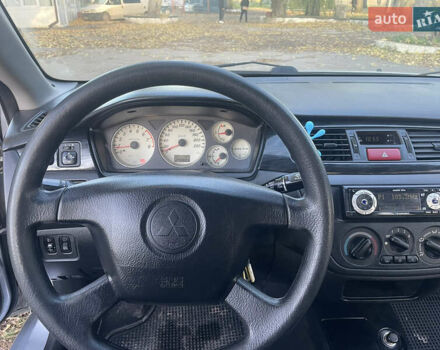 Сірий Міцубісі Lancer, об'ємом двигуна 1.58 л та пробігом 271 тис. км за 3000 $, фото 27 на Automoto.ua