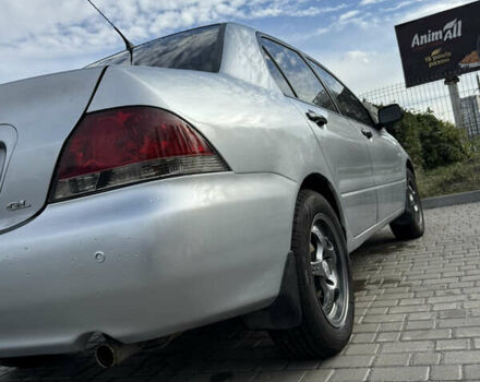 Серый Мицубиси Лансер, объемом двигателя 1.29 л и пробегом 263 тыс. км за 3400 $, фото 2 на Automoto.ua