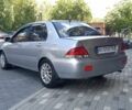 Серый Мицубиси Лансер, объемом двигателя 1.6 л и пробегом 353 тыс. км за 2999 $, фото 2 на Automoto.ua