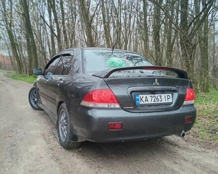 Сірий Міцубісі Lancer, об'ємом двигуна 1.58 л та пробігом 360 тис. км за 4000 $, фото 5 на Automoto.ua