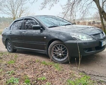 Сірий Міцубісі Lancer, об'ємом двигуна 1.58 л та пробігом 360 тис. км за 4000 $, фото 3 на Automoto.ua