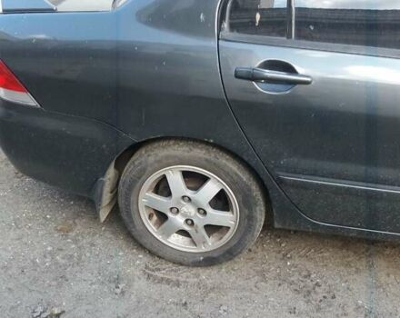 Сірий Міцубісі Lancer, об'ємом двигуна 1.58 л та пробігом 531 тис. км за 2828 $, фото 5 на Automoto.ua