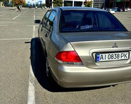 Серый Мицубиси Лансер, объемом двигателя 1.3 л и пробегом 245 тыс. км за 3000 $, фото 1 на Automoto.ua