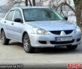 Серый Мицубиси Лансер, объемом двигателя 1.3 л и пробегом 299 тыс. км за 3950 $, фото 1 на Automoto.ua
