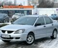 Серый Мицубиси Лансер, объемом двигателя 1.3 л и пробегом 289 тыс. км за 3399 $, фото 1 на Automoto.ua