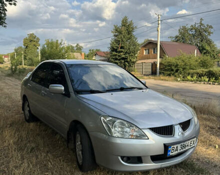 Серый Мицубиси Лансер, объемом двигателя 1.58 л и пробегом 234 тыс. км за 4400 $, фото 2 на Automoto.ua