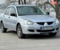 Сірий Міцубісі Lancer, об'ємом двигуна 1.3 л та пробігом 299 тис. км за 4200 $, фото 1 на Automoto.ua