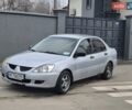 Серый Мицубиси Лансер, объемом двигателя 1.29 л и пробегом 259 тыс. км за 2999 $, фото 1 на Automoto.ua