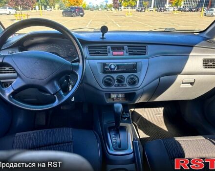 Серый Мицубиси Лансер, объемом двигателя 1.3 л и пробегом 245 тыс. км за 3000 $, фото 9 на Automoto.ua