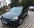 Сірий Міцубісі Lancer, об'ємом двигуна 1.6 л та пробігом 260 тис. км за 6000 $, фото 1 на Automoto.ua