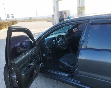 Сірий Міцубісі Lancer, об'ємом двигуна 1.58 л та пробігом 360 тис. км за 4000 $, фото 13 на Automoto.ua