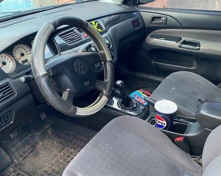 Сірий Міцубісі Lancer, об'ємом двигуна 1.58 л та пробігом 307 тис. км за 3800 $, фото 5 на Automoto.ua