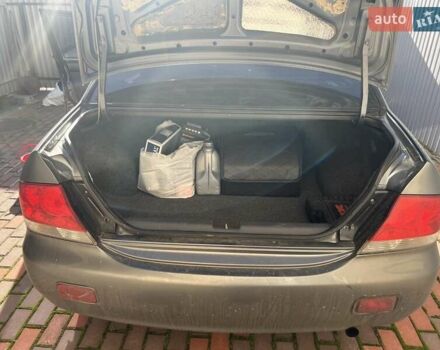Сірий Міцубісі Lancer, об'ємом двигуна 1.58 л та пробігом 262 тис. км за 3900 $, фото 4 на Automoto.ua