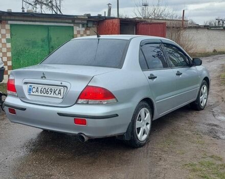 Сірий Міцубісі Lancer, об'ємом двигуна 0.16 л та пробігом 216 тис. км за 4150 $, фото 4 на Automoto.ua