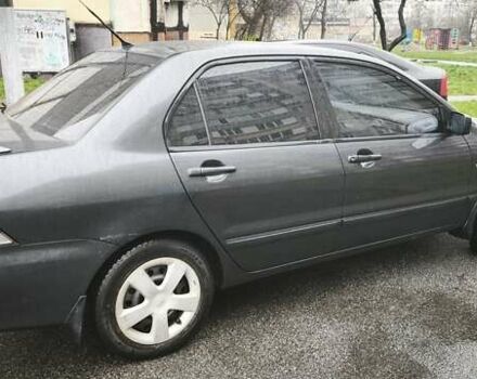 Сірий Міцубісі Lancer, об'ємом двигуна 1.58 л та пробігом 110 тис. км за 2999 $, фото 6 на Automoto.ua
