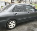 Сірий Міцубісі Lancer, об'ємом двигуна 1.58 л та пробігом 110 тис. км за 2999 $, фото 6 на Automoto.ua