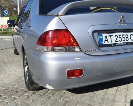 Сірий Міцубісі Lancer, об'ємом двигуна 1.58 л та пробігом 320 тис. км за 3700 $, фото 7 на Automoto.ua
