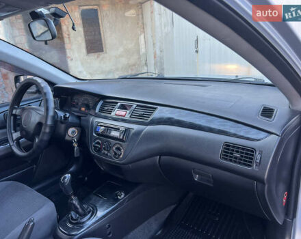 Серый Мицубиси Лансер, объемом двигателя 1.6 л и пробегом 320 тыс. км за 3650 $, фото 29 на Automoto.ua