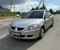 Серый Мицубиси Лансер, объемом двигателя 1.3 л и пробегом 300 тыс. км за 3400 $, фото 1 на Automoto.ua