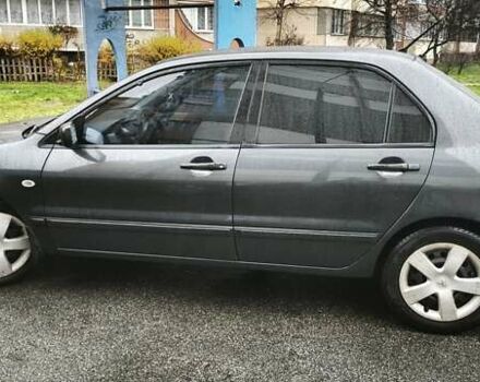 Сірий Міцубісі Lancer, об'ємом двигуна 1.58 л та пробігом 110 тис. км за 2999 $, фото 4 на Automoto.ua